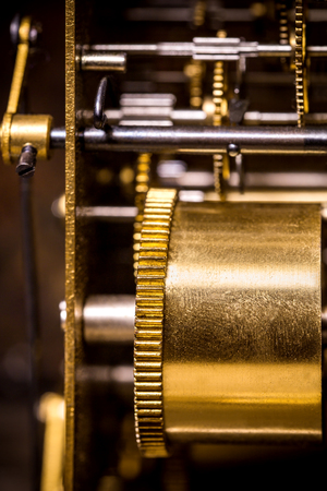 Closeup of a clockwork with cogs and brass
