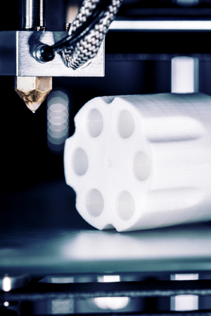 Cartridges and revolver drum are printed in a 3D printer, concepts such as arms trade and weapons...