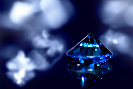 Sapphire or blue diamond with brilliant-cut and shiny background, closeupの写真素材