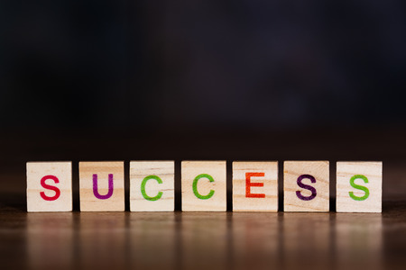 The word success, made up of many colorful letters on wooden blocksの写真素材