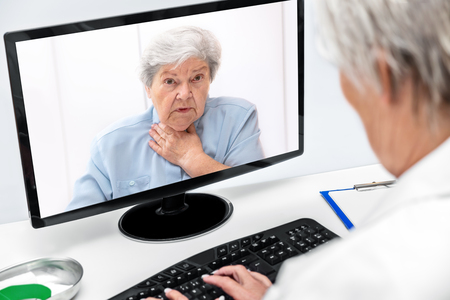 Telemedicine and eHealth with a elderly woman and a female doctor, online diagnosticの写真素材