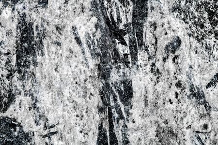 Closeup of Tourmaline or schorl minerals into matrix, pattern background with details of mineralogy