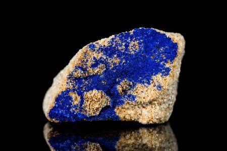 Raw azurite mineral stone in front of black background, mineralogy and esotericismの写真素材