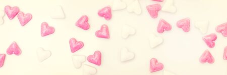 Banner Vintage, white and pink sugar hearts, concept love and bakeryの写真素材