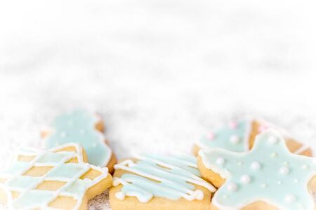 Delicious christmas cookies with blue frosting or royal icing, white background copyspaceの写真素材