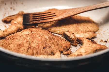 King and oyster mushrooms with coating browning and roasting in a pan, vegan gourmet foodの写真素材