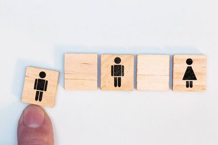 Wooden blocks with manlike figures, social distancing based on corona virus, concept prevention and...