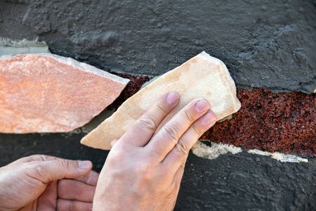 freshly laid quartzite stone slabs, tile adhesive and grey grout, outdoorの写真素材