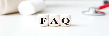 Header, dices with word FAQ and medical office background, frequently asked questionsの写真素材