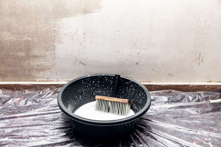 a concrete wall is freshly primed before painting or wallpaperingの写真素材