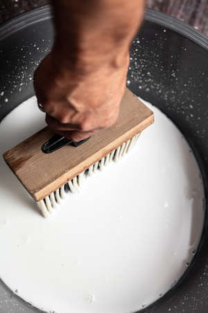 a concrete wall is freshly primed before painting or wallpaperingの写真素材