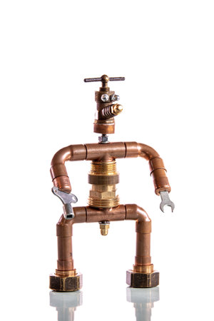 funny miniature craftsman, built from tools and materials, concept heating engineer or installerの写真素材