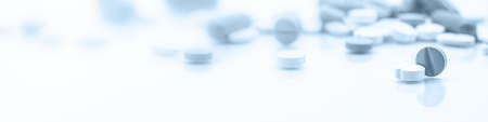 banner or header with medicine and medical equipment such as syringes, tablets and pillsの写真素材