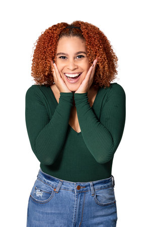 attractive woman with  hands on face making surprised expression on white backgroundの写真素材