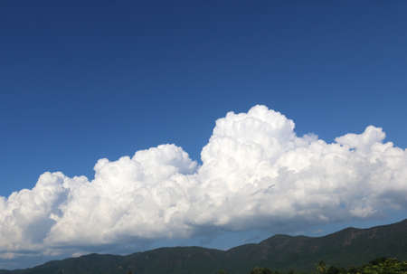 clouds in the blue sky and mountainの写真素材