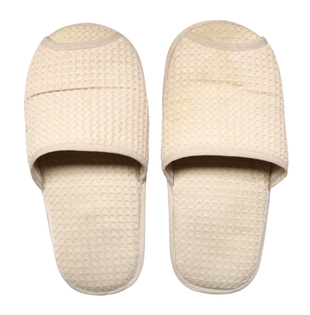 Old slippers top view isolated on white backgroundの写真素材