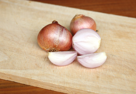 shallots slice on wooden plate