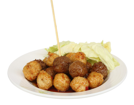 Meatball fried with sauce in dish isolated on white backgroundの写真素材