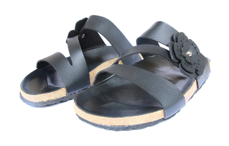 Woman's leather sandals isolated on white backgroundの写真素材