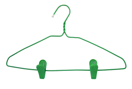 Old green clothes hanger for trousers and skirts isolated on white background.の写真素材