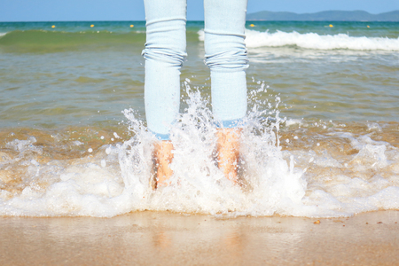 Woman walking on a beachの写真素材