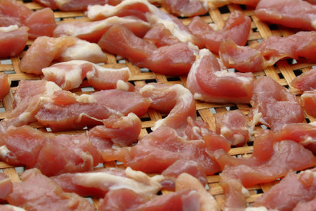 Fresh pork pieces that are dried in the sun for cooking. Food preservationの写真素材