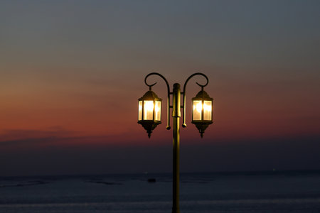 Retro lamps provide illumination at dusk.の写真素材