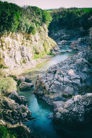 glimpse of the Fiora River at Vulci an ancient Etruscan city in the province of Viterboの写真素材