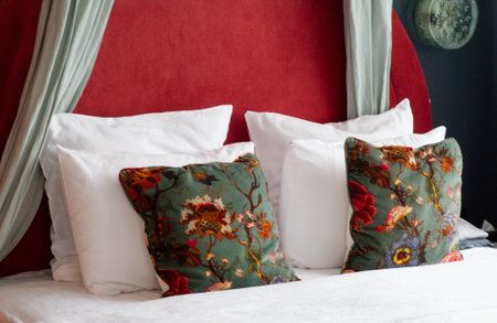 close up green pillows on the red bedの写真素材
