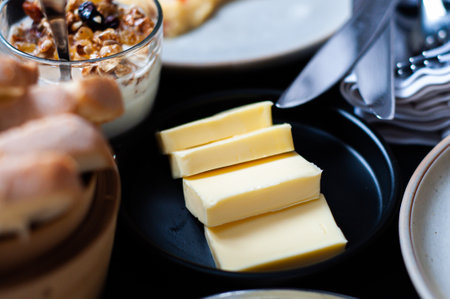 breakfast butter on black plateの写真素材