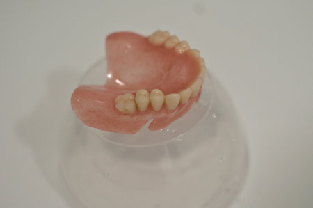 A set of dental dentures on white background