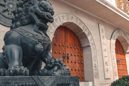 Lion statue in front of the Jing An Temple in Shanghai Chinaのeditorial素材
