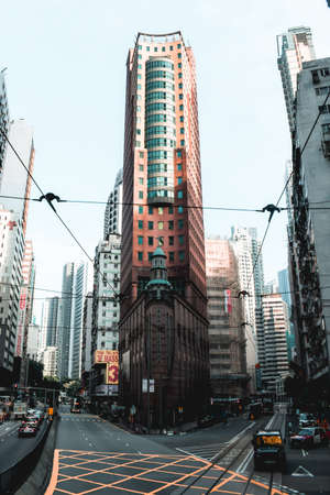 Elegant tall corner office building on the streets of Hong Kong Island