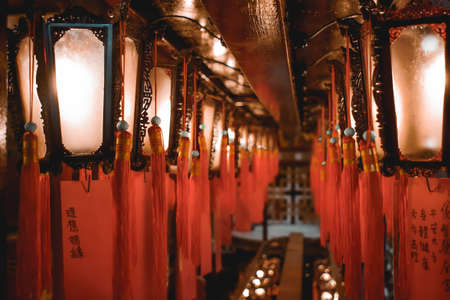 Two lines of lanterns hanging from the ceiling of the Man Mo Temple in Hong Kong Chinaのeditorial素材
