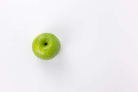 A fresh ripe green apples isolat on white background, healthy apple for cookingの写真素材