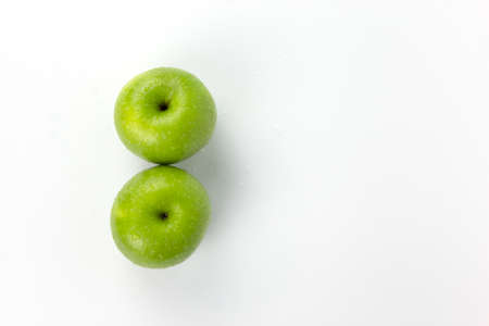Two ripe green apples isolat on white background, fresh green apples fruit for healthy cooking conceptの写真素材