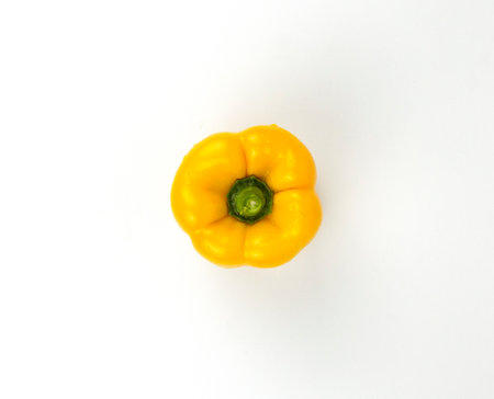 A yellow bell pepper isolated on white backgroundの写真素材