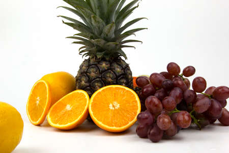 Fresh Orange juice in glass isolated on white background, fresh orange jiuce drink with grapes for healthy drink, good health of fruitsの写真素材