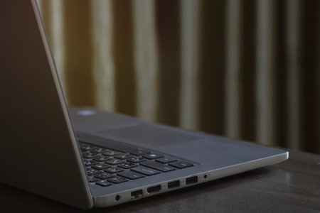 A laptop computer on the table in room