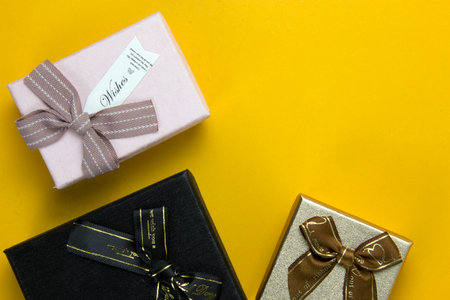 New Year and Christmas gift boxes concepts, and Realistic  gifts boxes on yellow background, set of...