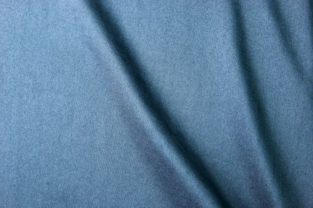 A dark blue fabric, clothes textile, wallpaper, fashion concepts of silk and cottons, Texture, background. template. Silk fabric blue, Blue silk drapery and upholstery fabric.の写真素材