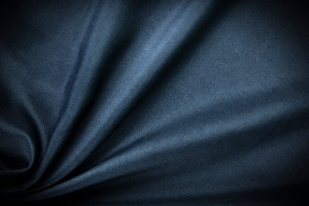 Dark blue fabric Texture blue, background, pattern. Texture of green silk fabric. Beautiful emerald soft silk cloth.の写真素材