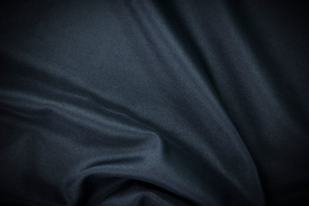 Dark blue fabric Texture blue, background, pattern. Texture of green silk fabric. Beautiful emerald soft silk cloth.の写真素材