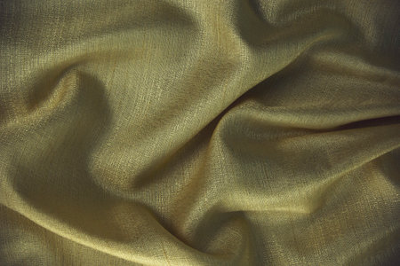 Golden fabric texture design, premium wavy cotton sheet templates for decoration design and yellow background.の写真素材