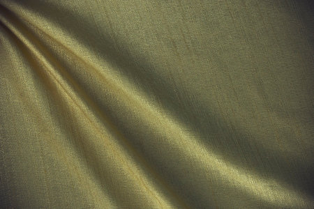 Beautiful smooth abstract background design, A text space.elegant wavy beige, light gold satin silk luxury cloth fabric texture design.の写真素材