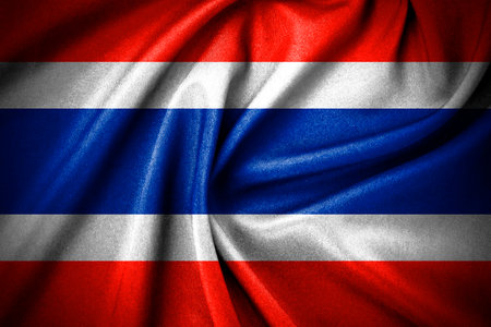 Dark curved of thailand flag made by cotton fabric material, and National Flag of Thailand - Rectangular Shape patriotic symbolの写真素材