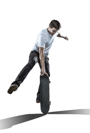 Skateboarder making trick isolated on white backgroundの写真素材