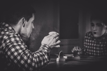 Male mime is putting white make-up close-upの写真素材