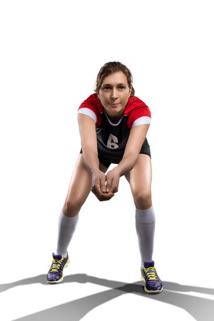 Female volleyball player in prepared position isolatedの写真素材