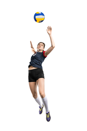 Female volleyball player hitting the ballの写真素材